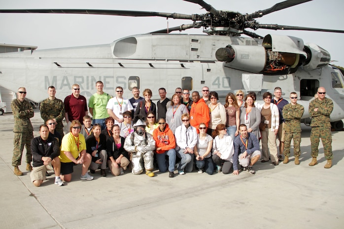 Marines pose for a photo with teachers on the flightline Jan. 11 during the 2012 Recruiting Station Twin Cities Educators Workshop. For additional imagery from the event, visit www.facebook.com/rstwincities.