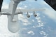 A C-5 Galaxy approaches a KC-10 Extender to be refueled over the coast of California during a training mission Dec. 14. (U.S. Air Force photo/ Airman 1st Class Nicole Leidholm)