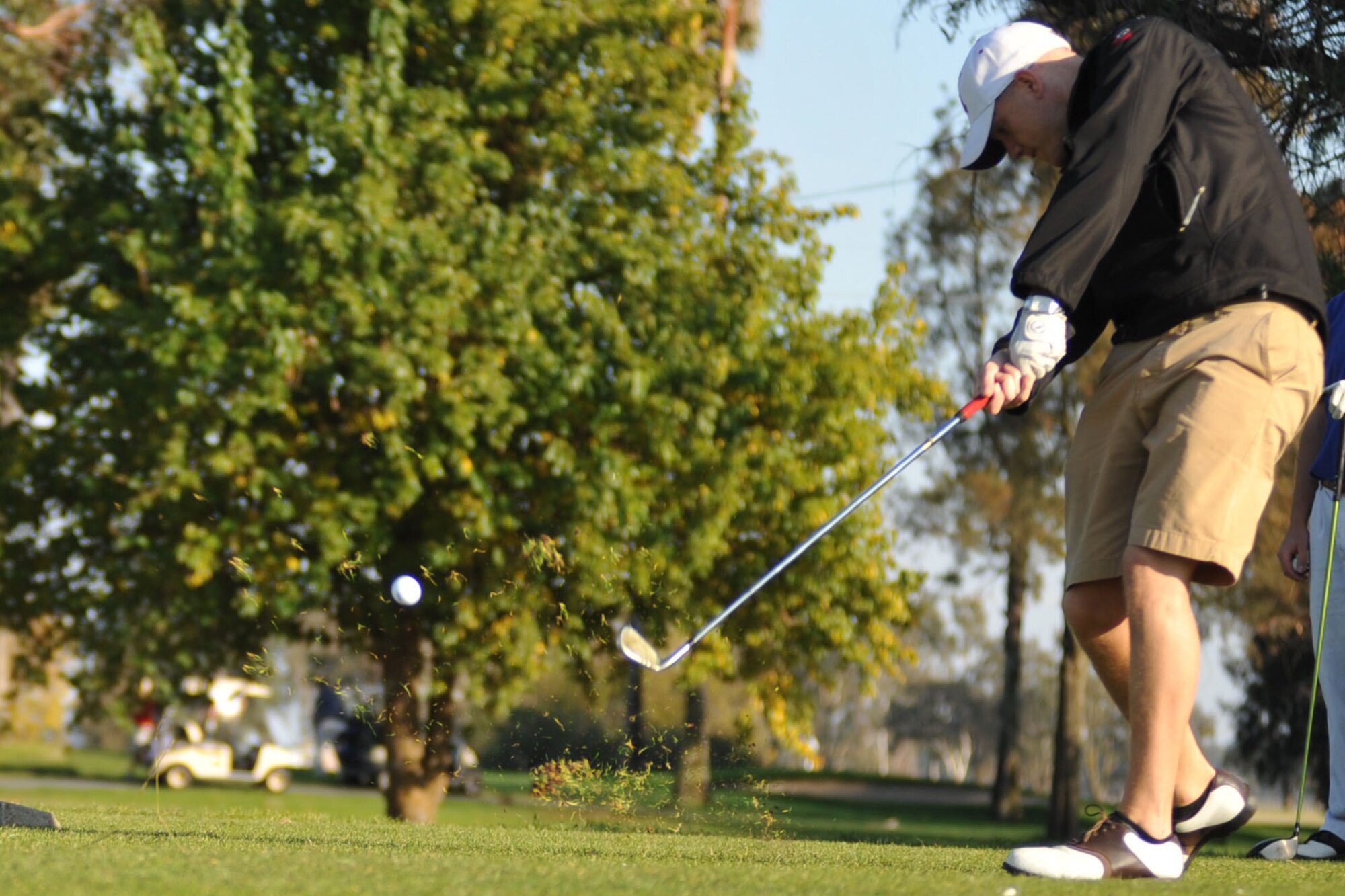 1st Lt. Mike Cavanaugh, pilot 6th APS, tees off at the 16th hole at Cypress Lakes Golf Course, Travis Air Force Base, November  10, 2011. (U.S. Air Force photo/Airman 1st Class Nicole Leidholm/Released)