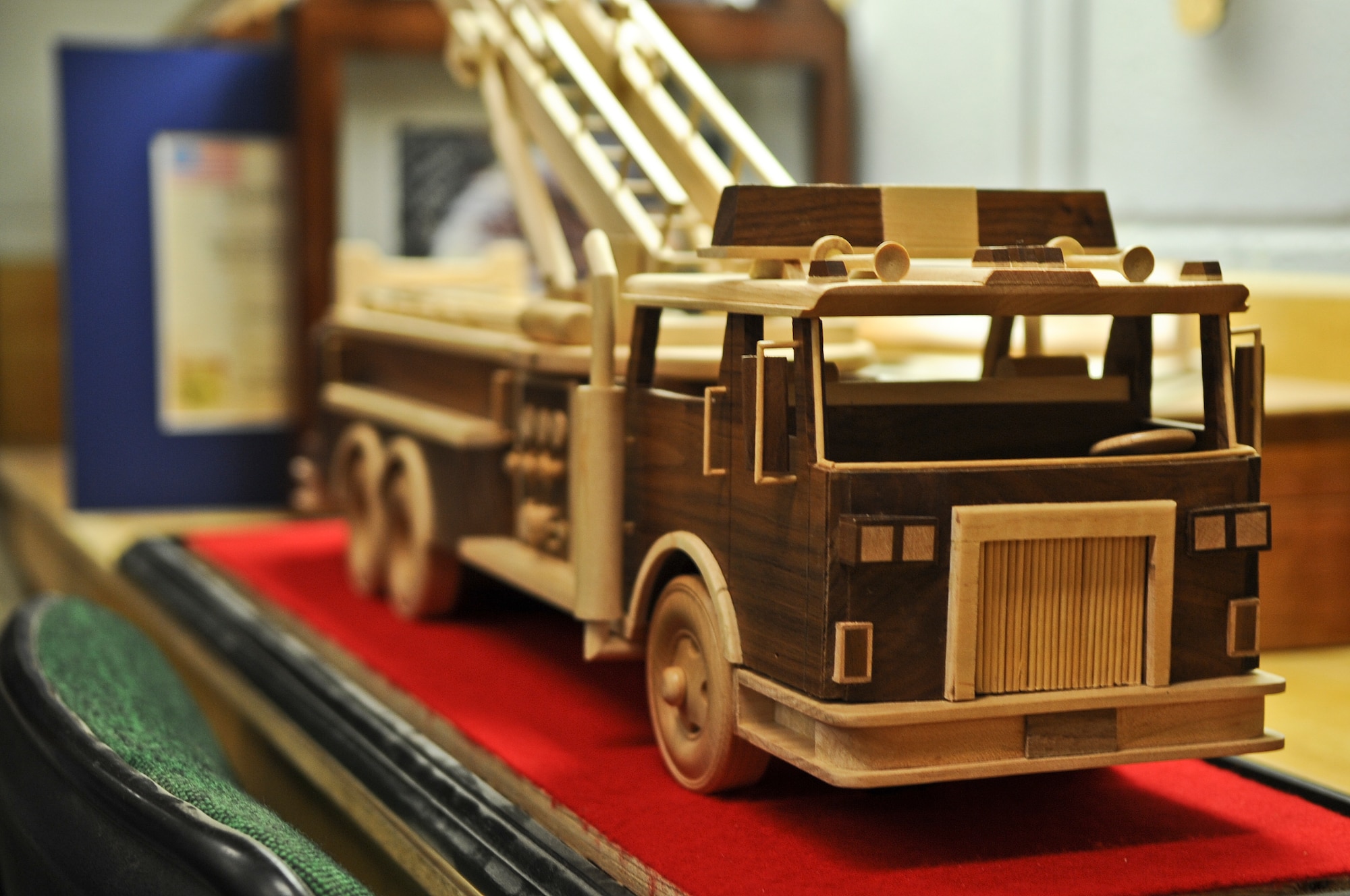 A handmade fire truck is displayed at the Arts and Crafts Center’s wood shop at Moody Air Force Base, Ga., Jan. 11, 2012. John Fishbach Sr., 23rd Force Support Squadron woodworker, created the fire truck which took four months to complete. (U.S. Air Force photo by Airman 1st Class Olivia Dominique/Released)