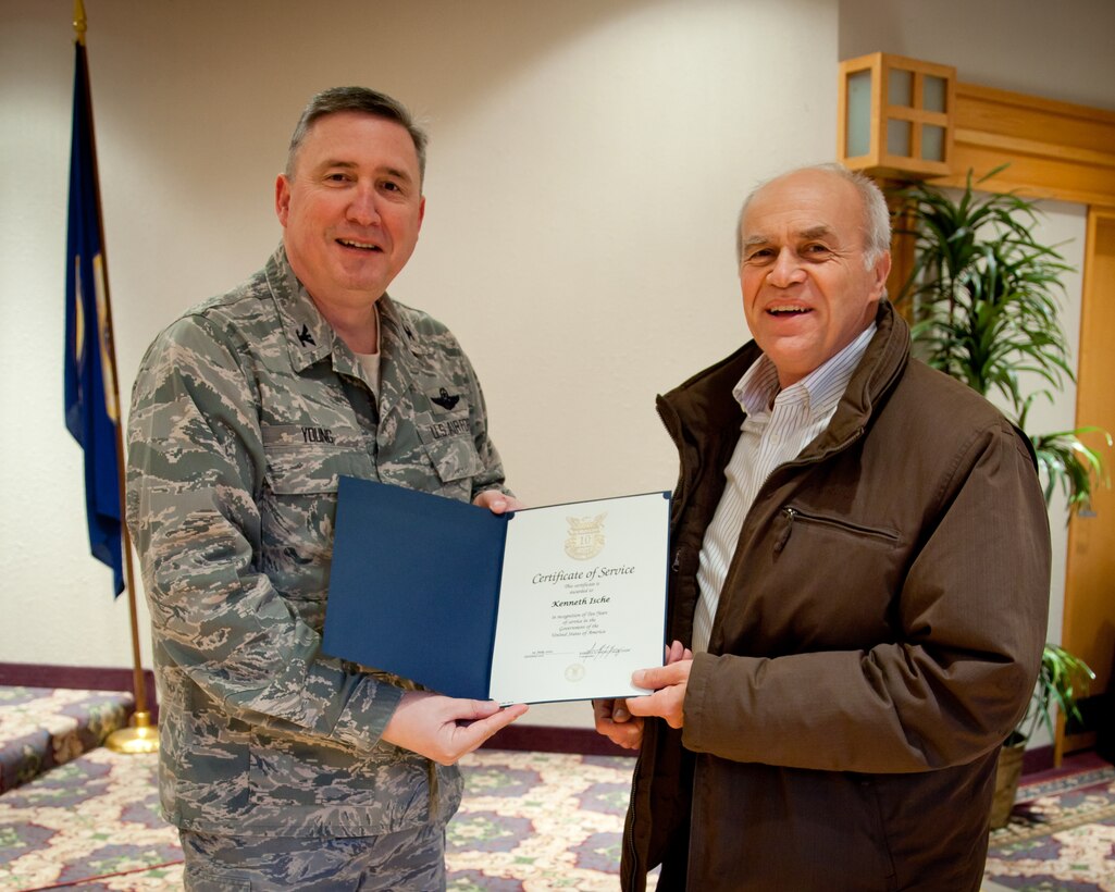 Col. Darrell Young, 934th Airlift Wing commander, presents Kenneth Ische a 10 Year Service Award today at Minneapolis Air Reserve Station, Minn.  (Air Force Photo/Shannon McKay)