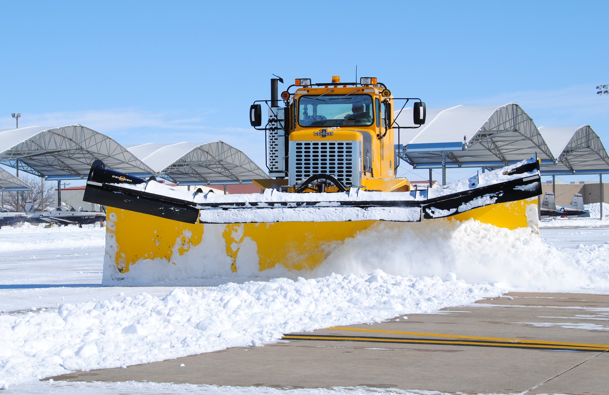 The Pavements and Grounds shop at Vance Air Force Base, Okla., removed record-breaking snow falls from the runways, taxiways, roads and sidewalks during the winter of 2011.  (U.S. Air Force photo/ Joe B. Wiles)