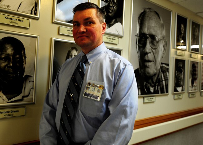 Lt. Col. John Painter walks by the Low Country Heroes wall at the Ralph
H. Johnson Veteran's Affairs Medical Center in Charleston, S.C., Jan. 5.
Painter, the 315th Airlift Wing chaplain has been an Air Force Reserve
chaplain for 15 years and also works as a chaplain at the VA hospital.
Military chaplains serve as everyday spiritual needs ministers and provide
religious counseling to service members and their families. (U.S. Air Force
photo/ Staff Sgt. Nicole Mickle)  
