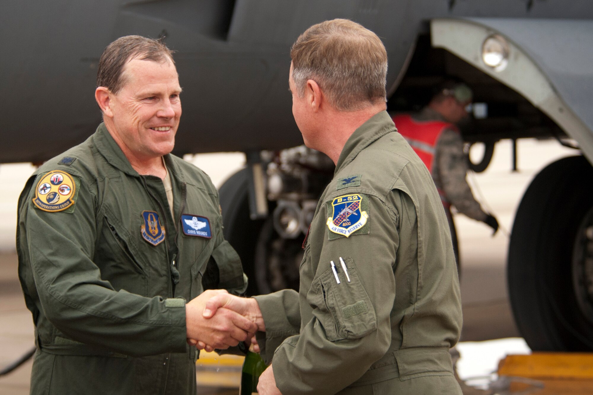 U.S. Air Force Lt. Col. Chris Rounds, 307th Bomb Wing Chief of Standardization and Evaluation, is congratulated by Col. Keith Schultz, 307th Operations Group commander, after returning from a B-52 mission, Barksdale Air Force Base, La., Jan. 8, 2012. This marked the last flight for Rounds, who is retiring from the Air Force Reserve and with more than 5,800 flying hours in the B-52. (U.S. Air Force photo by Staff Sgt. Theodore Daigle/Released)