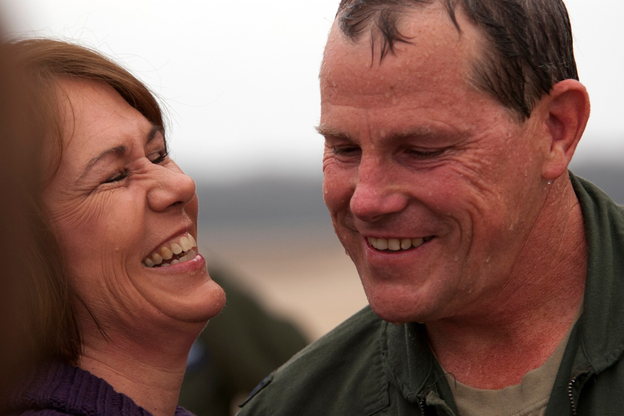 Linda and her husband, U.S. Air Force Lt. Col. Chris Rounds, are all smiles following his return from a B-52 mission, Barksdale Air Force Base, La., Jan. 8, 2012. Rounds, who is retiring from the Air Force Reserve, received a traditional wet-down since this marked his last flight in a B-52. (U.S. Air Force photo by Staff Sgt. Theodore Daigle/Released)