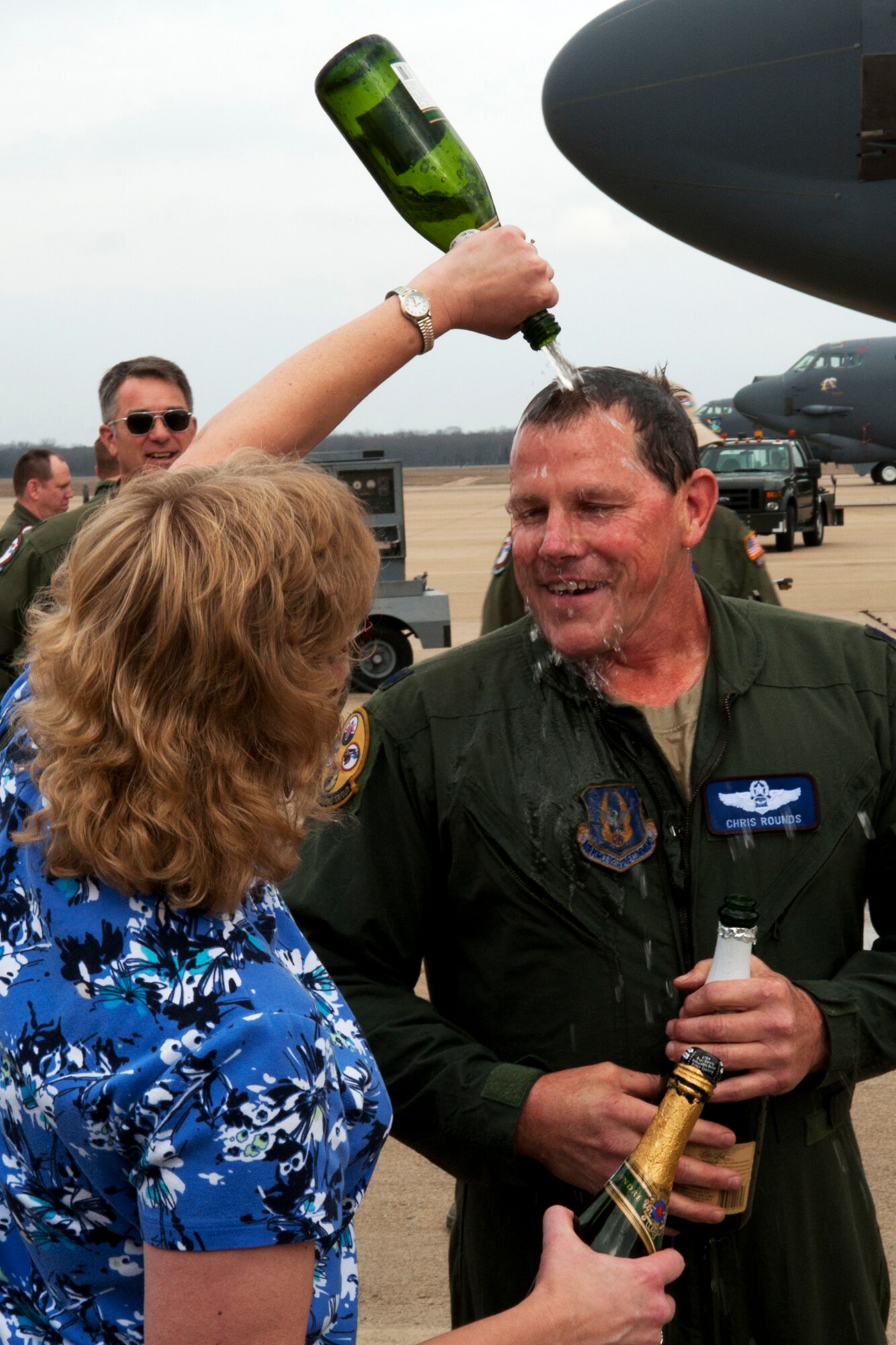 U.S. Air Force Lt. Col. Chris Rounds, 307th Bomb Wing Chief of Standardization and Evaluation, gets doused with champagne after returning from his last B-52 mission with the 93rd Bomb Squadron, Barksdale Air Force Base, La., Jan. 8, 2012. Rounds is retiring from the Air Force Reserve with over 5,800 flying hours in the B-52. (U.S. Air Force photo by Master Sgt. Greg Steele/Released)