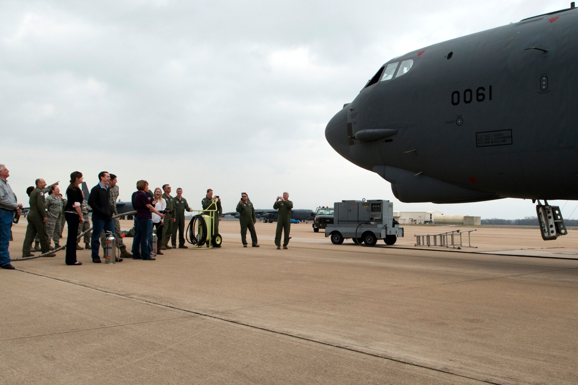 Family members and friends of U.S. Air Force Lt. Col. Chris Rounds wait for him to climb out of a B-52 after landing from his last flight with the 93rd Bomb Squadron, Barksdale Air Force Base, La., Jan. 8, 2012. Rounds is retiring after serving more than 20 years in the Air Force Reserve. (U.S. Air Force photo by Master Sgt. Greg Steele/Released)
