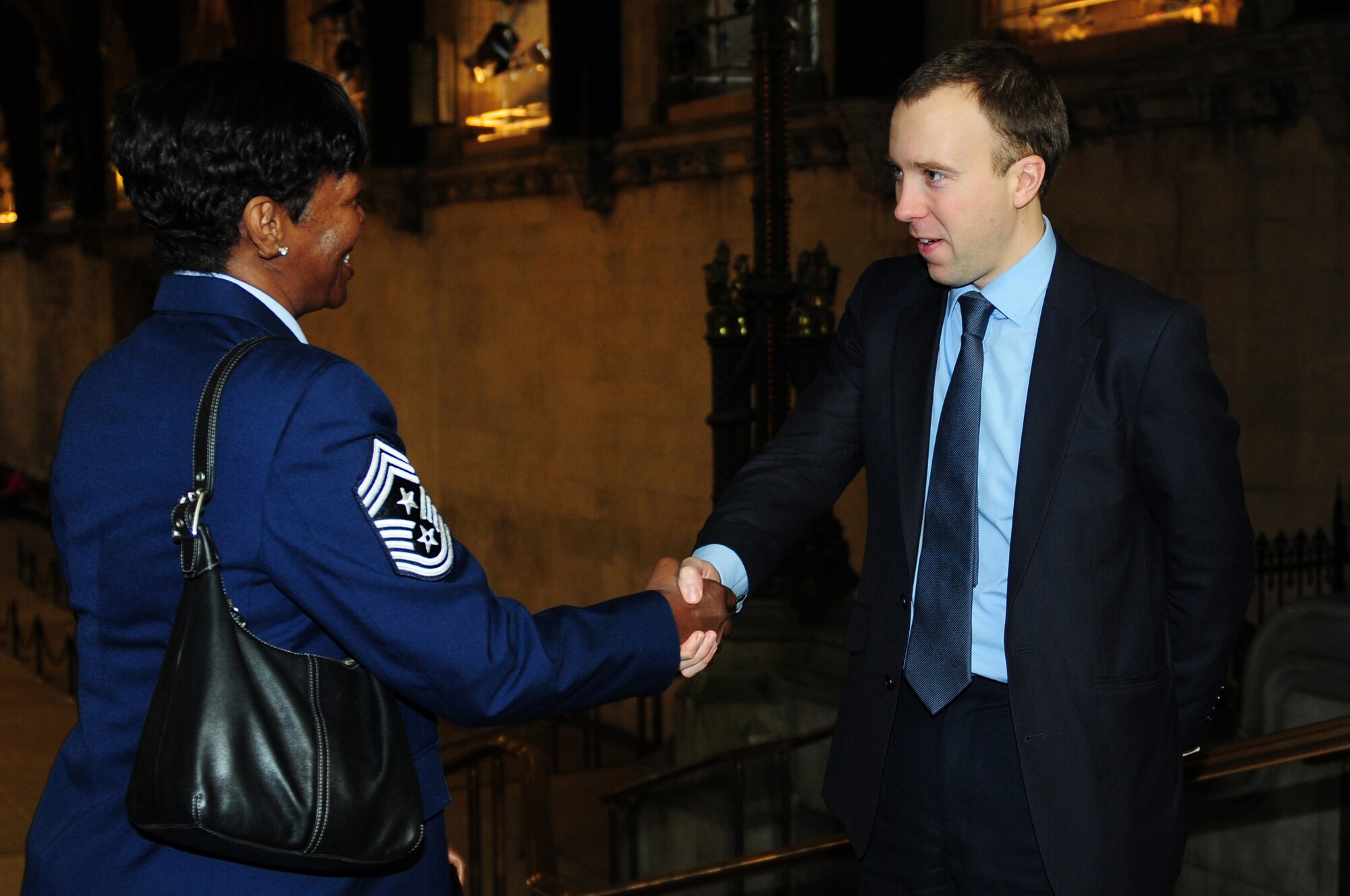 LONDON, England -- Matthew Hancock (right), Member of Parliament for West Suffolk, greets Chief Master Sgt. SaRita Lathan, 48th Fighter Wing command chief, while visiting the Houses of Parliament, Jan. 10, 2012. Members of the Liberty Wing visited Westminster and met informally with MPs from the constituencies where RAFs Lakenheath, Mildenhall and Feltwell are located. (U.S. Air Force photo by Senior Airman Lausanne Morgan)