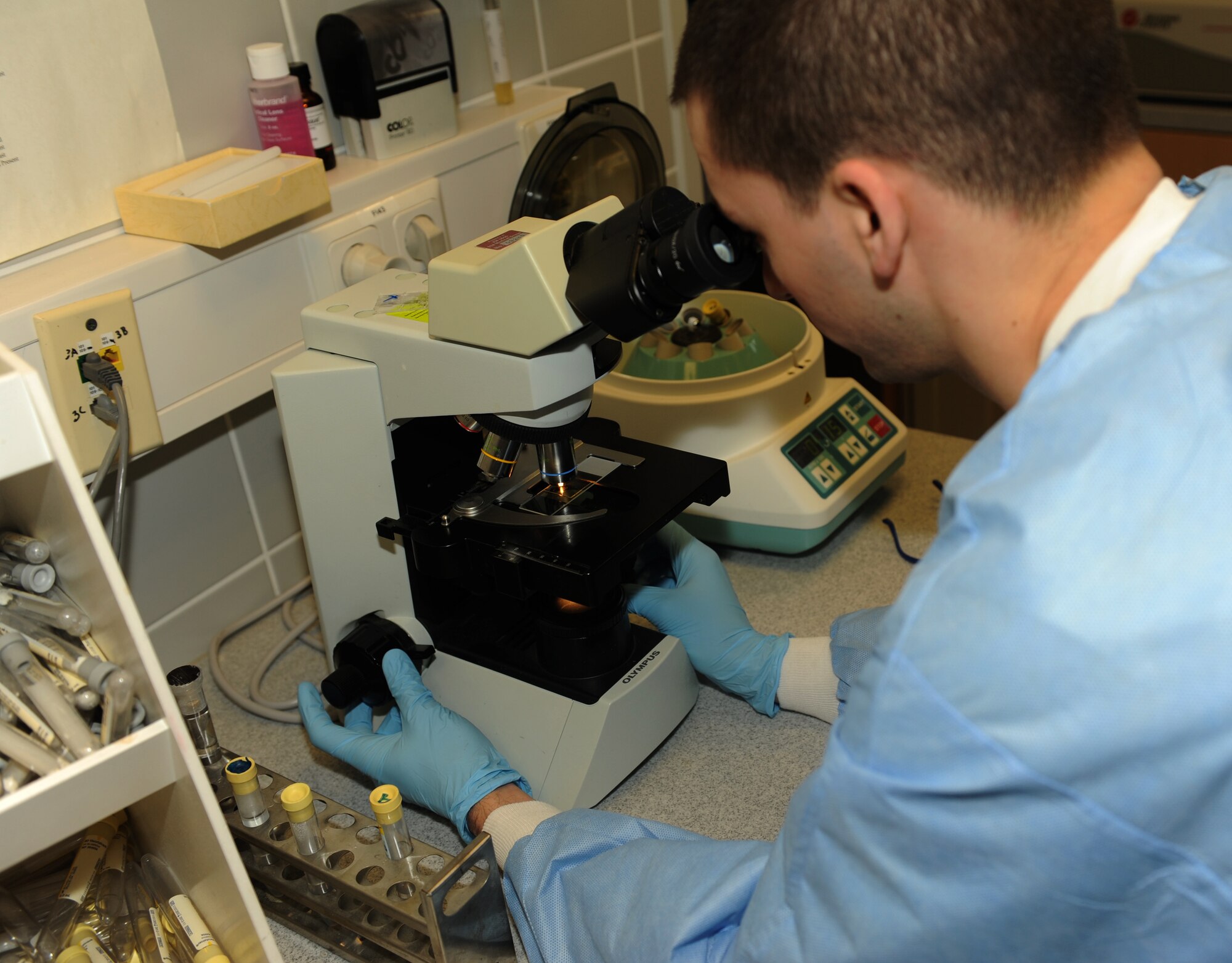 SPANGDAHLEM AIR BASE, Germany – Senior Airman Donald Chapman, 52nd Medical Support Squadron laboratory technician, examines a control group for a urine analyzer calibration at the clinic here Jan. 10. The laboratory technicians collect and test urine and blood samples for the diagnosis, treatment and prevention of diseases. These preventative measures help physicians provide the best possible healthcare to Saber Airmen and their families, retirees and Department of Defense employees. (U.S. Air Force photo/Airman 1st Class Matthew B. Fredericks)