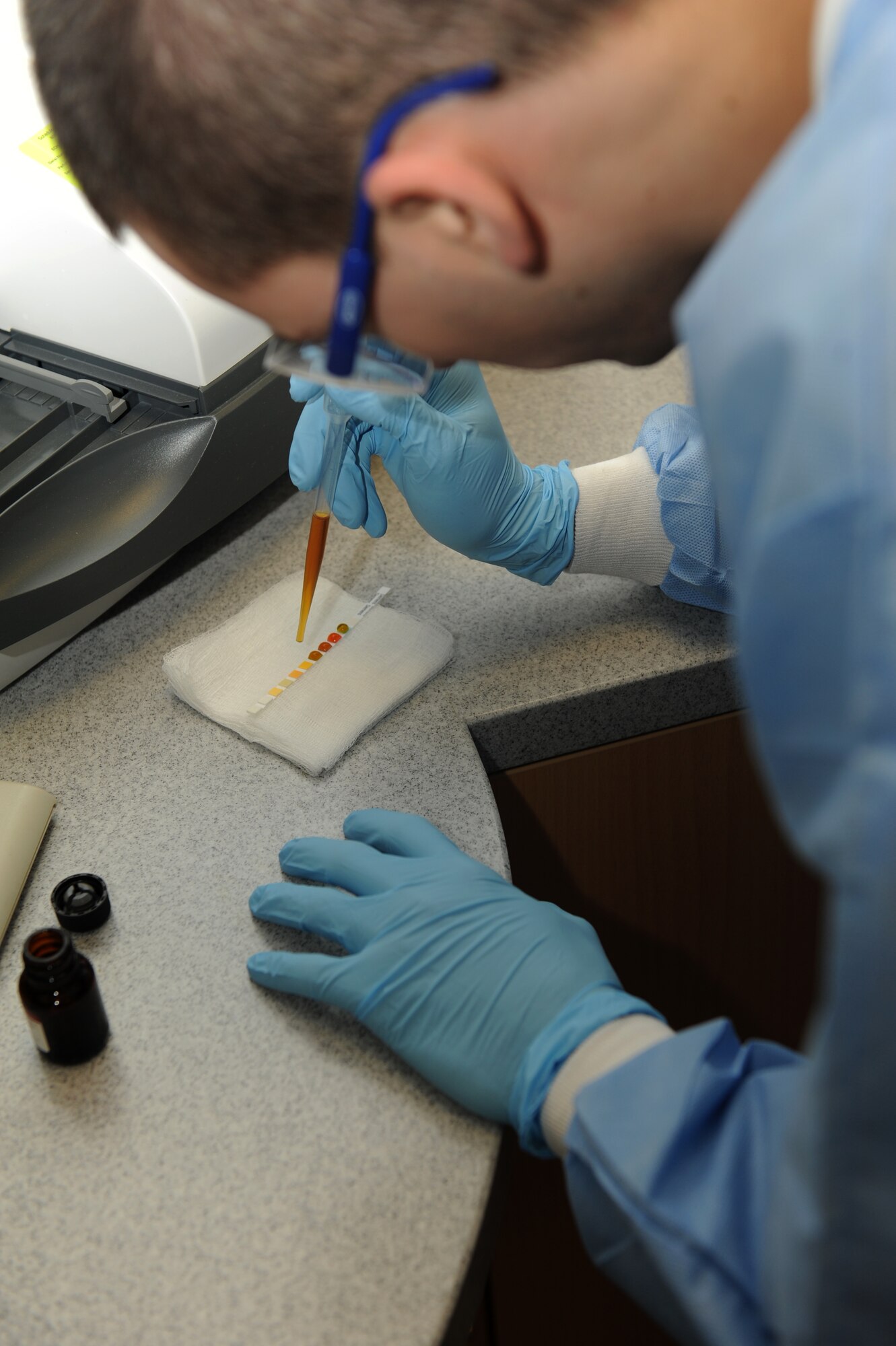 SPANGDAHLEM AIR BASE, Germany – Senior Airman Donald Chapman, 52nd Medical Support Squadron laboratory technician, places urinalysis controls on a test strip for a urine analyzer calibration at the clinic here Jan. 10. The laboratory technicians collect and test urine and blood samples for the diagnosis, treatment and prevention of diseases. These preventative measures help physicians provide the best possible healthcare to Saber Airmen and their families, retirees and Department of Defense employees. (U.S. Air Force photo/Airman 1st Class Matthew B. Fredericks)
