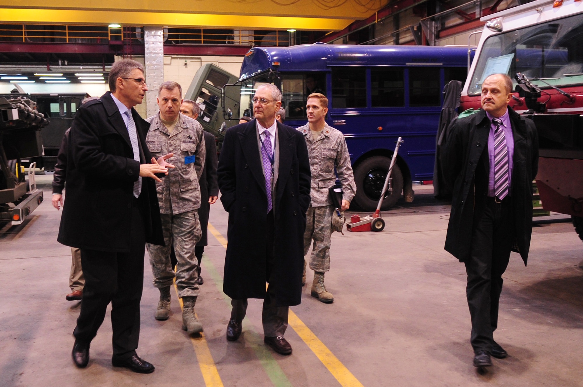 Ambassador to the Grand Duchy of Luxembourg, Robert Mandell (center), is briefed by Mr. Andre Straus, Central Regional Staging Facility director, during his visit, Luxembourg, Jan. 10, 2012. This was Ambassador Mandell's first visit to the facility. The CRSF is the only military presence in Luxembourg, and is responsible for 85 percent of war readiness material. (U.S. Air Force photo by Senior Airman Brittany Perry)