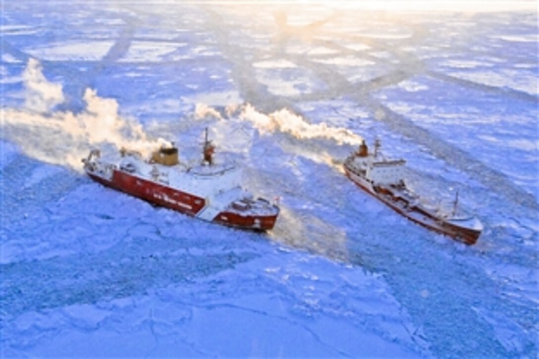 The U.S. Coast Guard Cutter Healy approaches the Russian-flagged tanker Renda while breaking ice around the vessel in the Bering Sea 97 miles south of Nome, Alaska, Jan. 10, 2012. The two vessels departed Dutch Harbor for Nome, Jan. 3, 2012. 