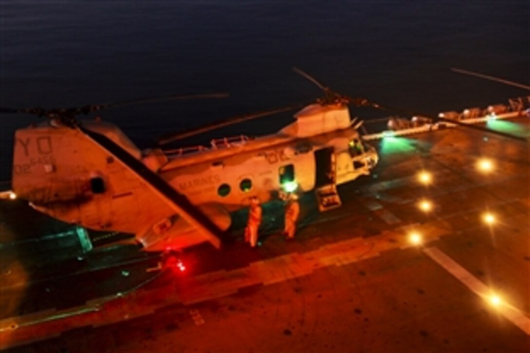 A CH-46E Sea Knight prepares to take off from the USS Makin Island, Jan. 10, 2012. The helicopter is assigned to the 11th Marine Expeditionary Unit's aviation combat element, Marine Medium Helicopter Squadron 268. The unit, deployed aboard the amphibious assault ship as part of the Makin Island Amphibious Ready Group, is providing support in the 5th Fleet area of responsibility, which includes the Gulf of Aden.