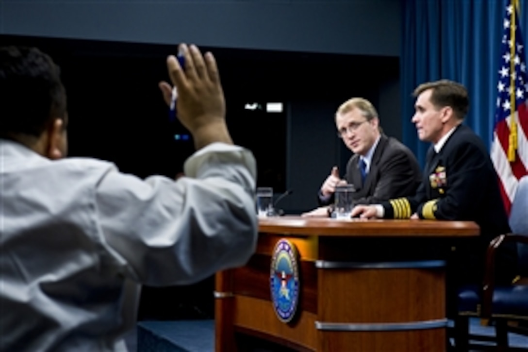Pentagon Press Secretary George Little calls on a reporter during a press briefing with Navy Capt. John Kirby, Pentagon spokesman, at the Pentagon, Jan. 11, 2012. Little and Kirby answered questions on a range of defense issues.