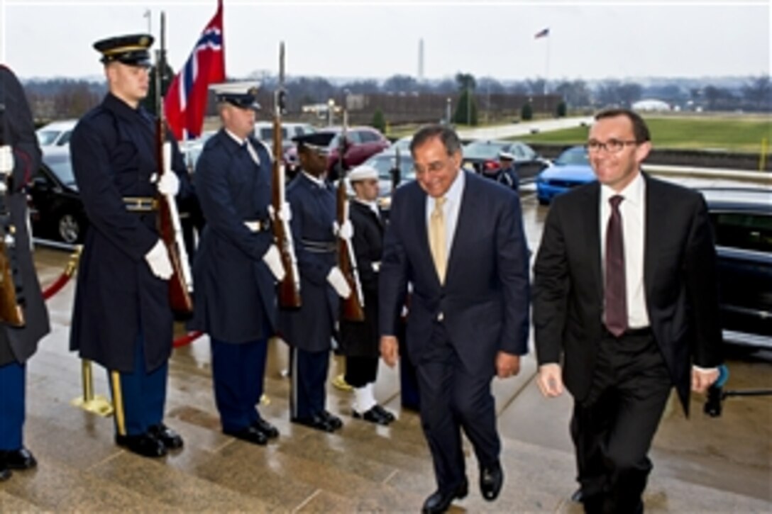 U.S. Defense Secretary Leon E. Panetta escorts Norwegian Defense Minister Espen Barth Eide through an honor cordon into the Pentagon, Jan. 11, 2012. Panetta and Eide met to discuss bilateral defense issues.