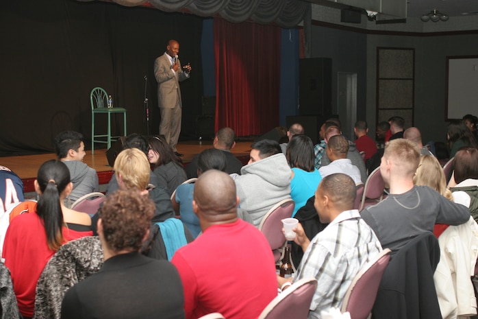 Comedian and entertainer, Daniel Dugar, entertains the crowd at the Iwakuni Ballroom here Jan. 12 during the “2012 Laugh Campaign.” Dugar opened for fellow comedian, D. L. Hughley. Both comedians brought their own distinctive style of rauncous::r::::n::humor to the crowd. No individual was safe from the verbal jabs that came from the comedians as they picked out people in the crowd.