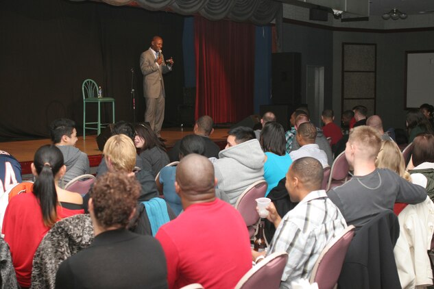 Comedian and entertainer, Daniel Dugar, entertains the crowd at the Iwakuni Ballroom here Jan. 12 during the “2012 Laugh Campaign.” Dugar opened for fellow comedian, D. L. Hughley. Both comedians brought their own distinctive style of rauncous::r::::n::humor to the crowd. No individual was safe from the verbal jabs that came from the comedians as they picked out people in the crowd.