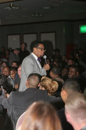 Comedian and entertainer, D. L. Hughley, star of such hits as the television shows “The Hughleys,” “The Original Kings of Comedy,” and former host of Black Entertainment Television’s “ComicView,” works his way through the crowd at the Iwakuni Ballroom here Jan. 12 during the “2012 Laugh Campaign.” Hughley’s sharp wit touched on a variety of topics including marriage and childrearing.