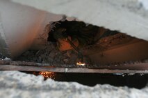 A technical rescue Marine with Chemical Biological Incident Response Force’s Technical Rescue Platoon attempts to cut through a steel plate in order to gain access to a tunnel where rescuers believe “victims” could be trapped during a simulated collapse during the joint 72-hour technical rescue training operation with the 911th U.S. Army Technical Rescue Engineer Company at the Downey Responder Training Facility. This technical rescue training operation at DRTF allowed the two units take the opportunity to train together to build a good working relationship and familiarity of each other’s capabilities and limitations, since they both cover the National Capitol Region they would work together if there were ever a disaster.