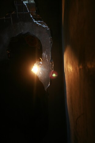 A technical rescue Marine with Chemical Biological Incident Response Force’s Technical Rescue Platoon attempts to cut through a steel plate in order to gain access to a tunnel where rescuers believe “victims” could be trapped during a simulated collapse during the joint 72-hour technical rescue training operation with the 911th U.S. Army Technical Rescue Engineer Company at the Downey Responder Training Facility. This technical rescue training operation at DRTF allowed the two units take the opportunity to train together to build a good working relationship and familiarity of each other’s capabilities and limitations, since they both cover the National Capitol Region they would work together if there were ever a disaster.
