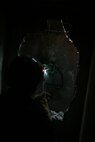A technical rescue Marine with Chemical Biological Incident Response Force’s Technical Rescue Platoon attempts to cut through a steel plate in order to gain access to a tunnel where rescuers believe “victims” could be trapped from a simulated collapse during the joint 72-hour technical rescue training operation with the 911th U.S. Army Technical Rescue Engineer Company at the Downey Responder Training Facility. This technical rescue training operation at DRTF allowed the two units take the opportunity to train together to build a good working relationship and familiarity of each other’s capabilities and limitations, since they both cover the National Capitol Region they would work together if there were ever a disaster.