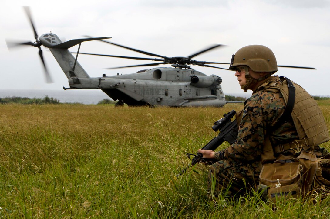 Sgt. Donald Christensen, an explosive ordinance disposal technician with Company C., Battalion Landing Team 1st Battalion, 4th Marines, 31st Marine Expeditionary Unit, provides security for a CH-53 Super Stallion helicopter during Marine Expeditionary Unit Exercise here, Jan. 12. MEUEX is a multi-week training exercise conducted prior to every 31st MEU deployment. The 31st MEU is the only continually forward-deployed MEU, and remains the nation’s force-in-readiness in the Asia-Pacific region.