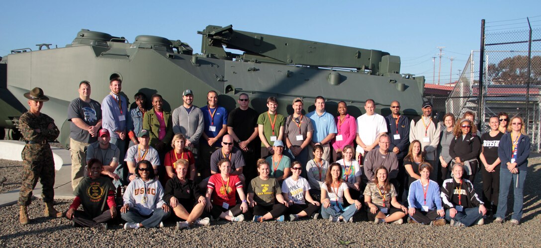 SAN DIEGO -- Educators from Marine Recruiting Station Chicago took a break from their day aboard Marine Corps Base Camp Pendleton to stand for a group photo. The 39 teachers from Recruiting Station Chicago toured the Marine Bases in the San Diego area. For more information regarding the workshop please visit www.facebook.com/mcrschicago. (U.S. Marine Corps photo by Sgt. George J. Papastrat) (Released)