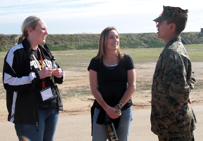 SAN DIEGO -- Elissa Schwass and Kelly Petring, educators from the Chicagoland area speak with a recruit while attending the Educators Workshop 9-13 Jan. The spoke with various recruits they had in school and had the opportunity to learn about the opportunities presented to those serving in the Marines. (U.S. Marine Corps photo by Sgt. George J. Papastrat)(Released)