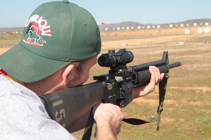 SAN DIEGO -- Ryan Sladek, an educator from the Chicago area sights in down range with an M16A4 during a life fire drill Jan. 12. Sladek, with 38 other educators from the Chicago area participated in the 2012 Educators Workshop. For more photos and information visit www.facebook.com/mcrschicago. (U.S. Marine Corps photo by Sgt. George J. Papastrat) (Released0