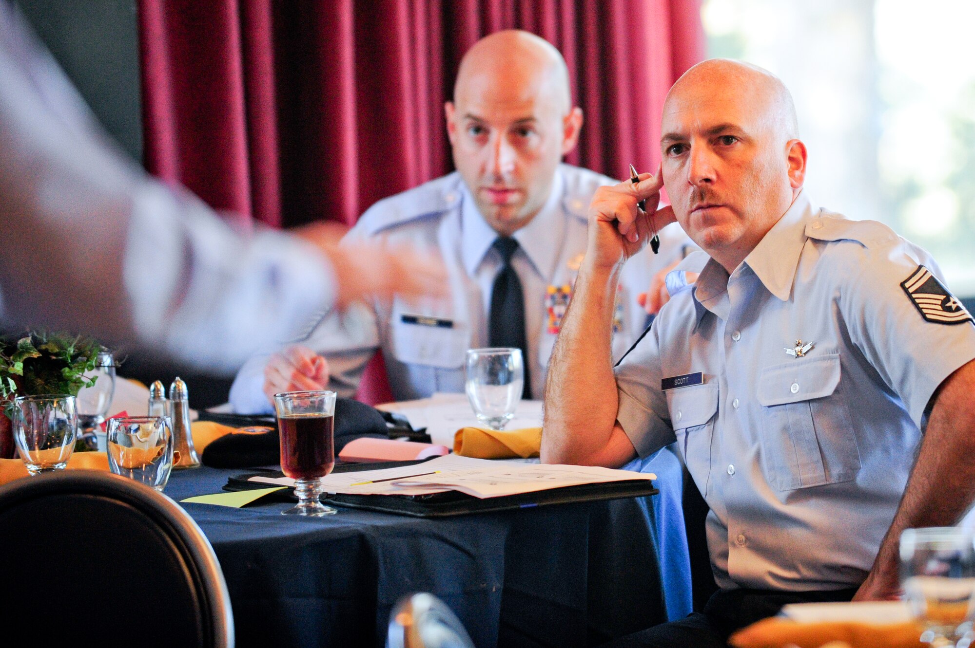 Senior Master Sgt. Todd M. Scott, right, gathers information during the 310th Space Wing off site conference that was held at the Air Force Academy's Falcon Club on Monday, Jan. 9. The purpose of the off site conference was for senior leadership to receive a "State of the Union" style status of the 310th SW and establish wing goals for calendar year 2012. (U.S. Air Force photo/Tech. Sgt. Nicholas B. Ontiveros).