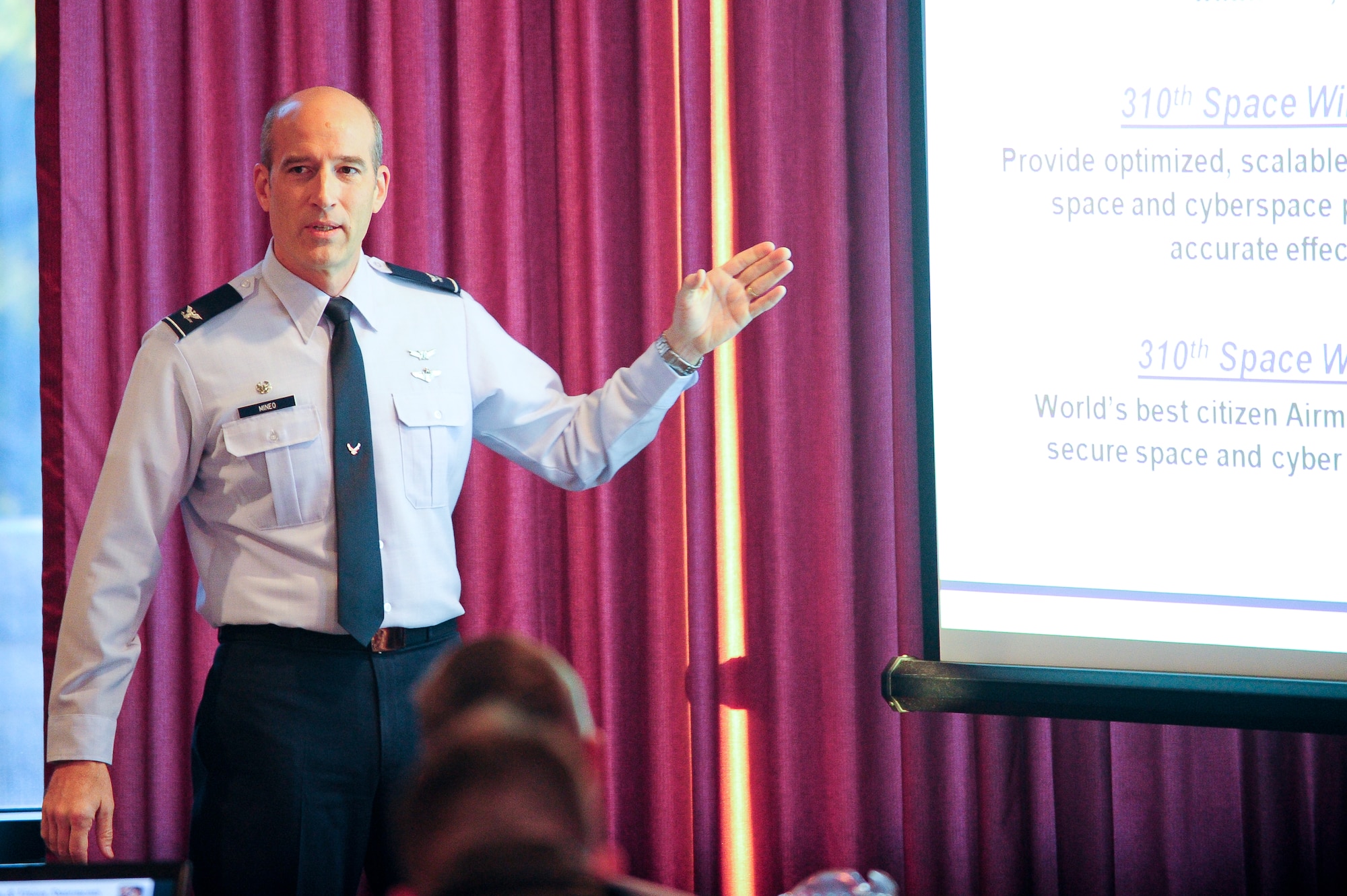 310th Space Wing commander Col. Jeffrey T. Mineo began the day with opening remarks during the 310th SW off site conference that was held at the Air Force Academy's Falcon Club on Monday, Jan. 9. The purpose was for senior leadership to receive "State of the Union" style status of the 310th SW and establish wing goals for calendar year 2012. (U.S. Air Force photo/Tech. Sgt. Nicholas B. Ontiveros).
