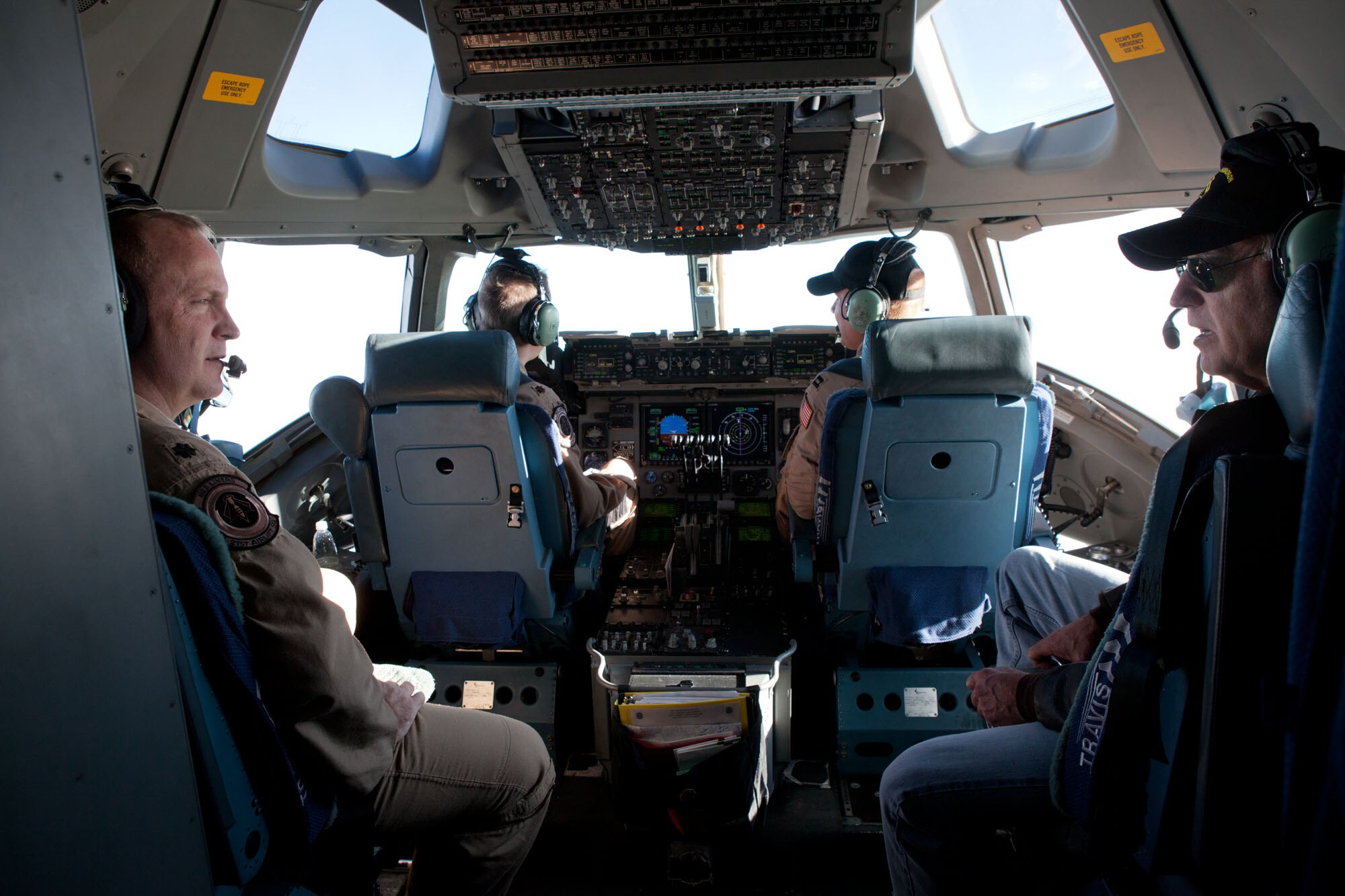 Biden speaks to Lt. Col. Louis Hanson, 21st Airlift Squadron director of operations, during the Nov. 29, 2011, flight aboard a Travis Globemaster III. (U.S. Air Force/courtesy photo)