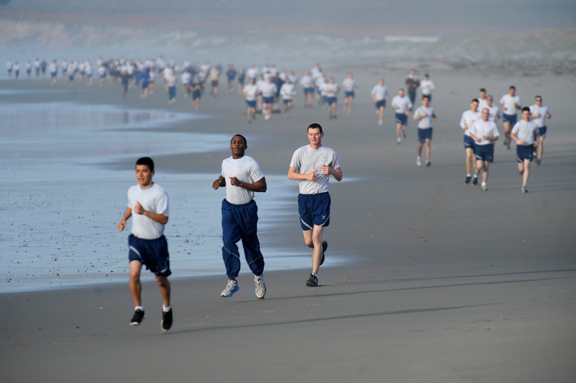 VANDENBERG AIR FORCE BASE, Calif. -- Team V members run on Wall Beach here during Col. Richard Boltz, 30th Space Wing commander's final run Wednesday, Jan. 11, 2012. More than 80 Vandenberg members ran three miles with the commander as a farewell gesture for him. (U.S. Air Force photo/Staff Sgt. Andrew Satran) 

 