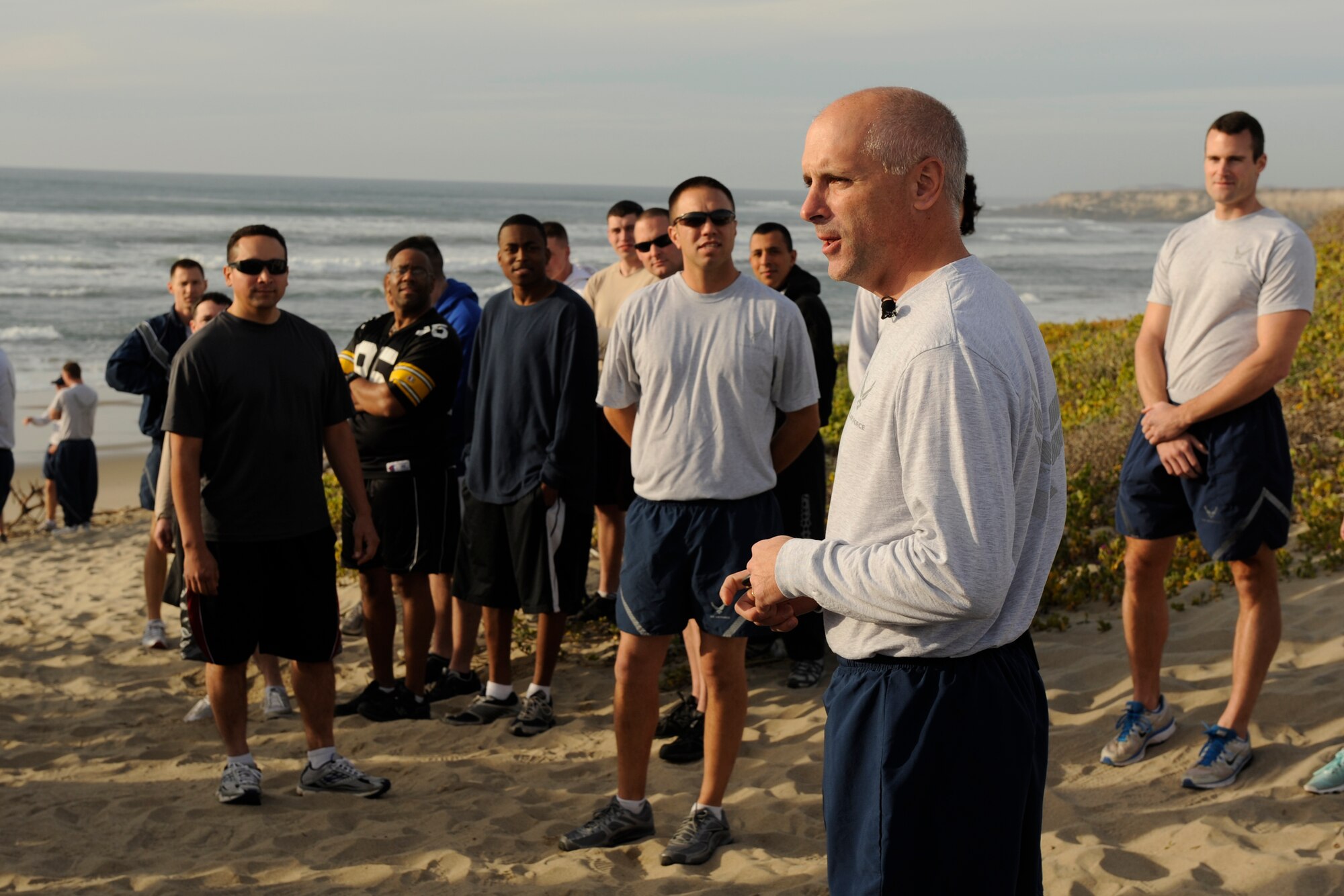 VANDENBERG AIR FORCE BASE, Calif. -- Col. Richard Boltz, 30th Space Wing commander, talks to Vandenberg Airmen before his final run as commander on Wall Beach here Wednesday, Jan. 11, 2012. More than 80 Vandenberg members ran three miles with the commander as a farewell gesture for him. (U.S. Air Force/Staff Sgt. Levi Riendeau)