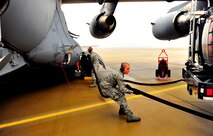 U.S. Air Force Senior Airman Andrew Mitalski and Airman 1st Class Thomas Asbury, 20th Component Maintenance Squadron fuel technicians, refuel a C-17 Globemaster, Jan. 10, 2012. Three C-5s and a C-17 landed at Shaw Air Force Base S.C., over a three-day period to pick up Airmen and aerospace ground equipment in support of a deployment tasking. (U.S. Air Force Photo by Senior Airman Neil D. Warner/Released)