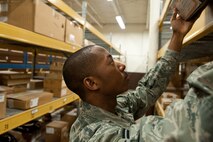 Airman 1st Class Terrell Harris, 28th Logistics Readiness Squadron supply technician, selects aircraft parts from inventory to complete a request at the 28th LRS supply shop on Ellsworth Air Force Base, S.D., Jan. 11, 2012. The supply shop houses a wide variety of parts and supplies on hand to meet requests in a timely manner. (U.S. Air Force photo by Airman Alystria Maurer/Released)