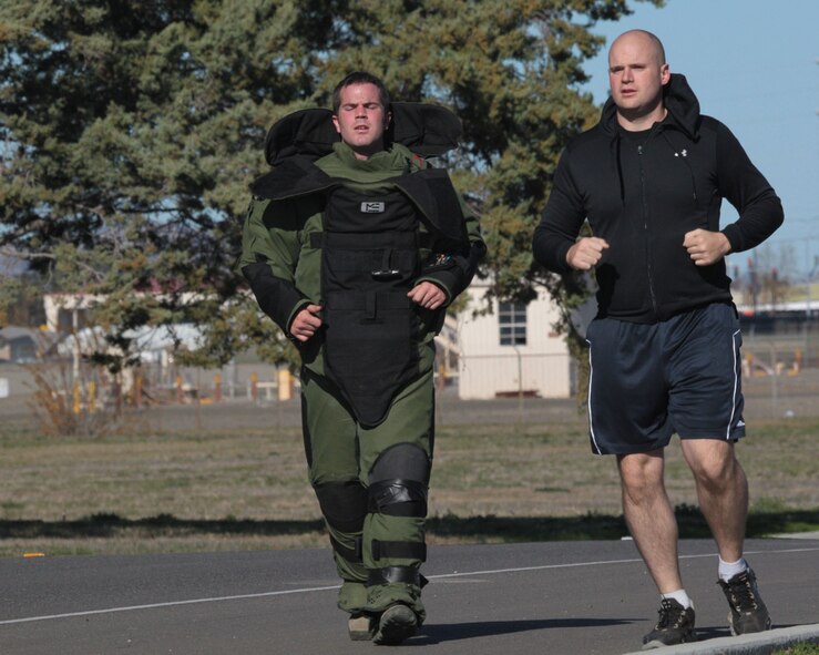 TRAVIS AIR FORCE BASE, Calif. -Senior Airman Steven J. McElheran, 349th Civil Engineer Squadron (left) and Tech. Sgt. Richard Dula, 60th CES, came out and support the Wounded Warriors foundation recently during the 2011 Travis Bomb Suit Run sponsored by the 60th Civil Engineer Squadron. (U.S. Air Force photo/Anne Kohutanycz)