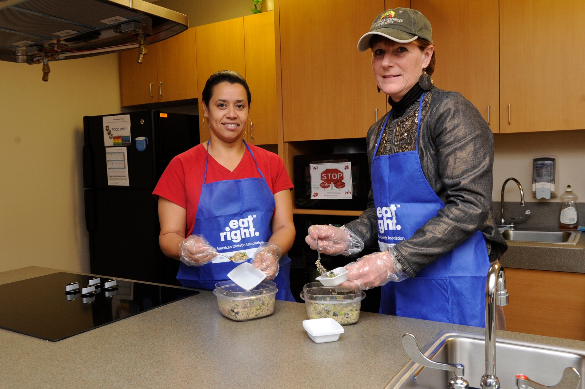 VANDENBERG AIR FORCE BASE, Calif. - Melinda Reed, the Health and Wellness Center’s health promotion dietitian, and Maggie Figueroa, a physical therapy technician, prepare healthy alternative snacks for an upcoming class here Wednesday, Jan. 11, 2012. The HAWC offers a variety of classes on healthy living, diabetes and cholesterol. The HAWC may be contacted by phone at 805-606-2221, or by email at vandenberg.HAWC@vandenberg.af.mil. Information on class times and registrations is available on line https://eis.afspc.af.mil/unit/30sw/30mos/HP/HAWC.  (U.S. Air Force photo/ Tech. Sgt. Scottie McCord) 