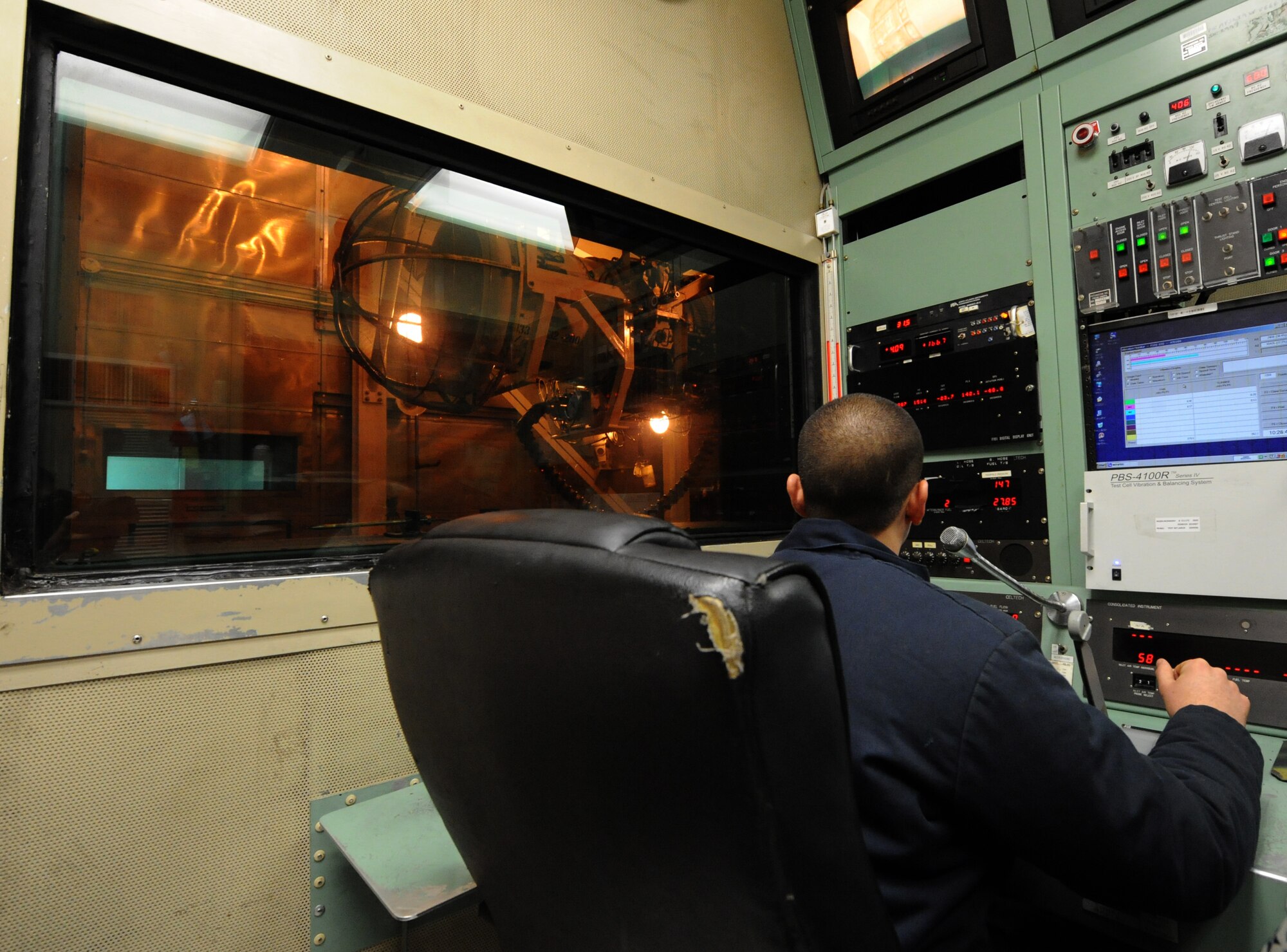 Staff Sgt. Anthony Rosado, 7th Component Maintenance Squadron, starts up a General Electric F101 turbofan jet engine for testing, Jan. 11, 2011, at Dyess Air Force Base, Texas. Testing is done to ensure performance is up to standards before reattaching the engine onto a B-1 Bomber. (U.S. Air Force photo by Airman 1st Class Jonathan Stefanko/ Released)
