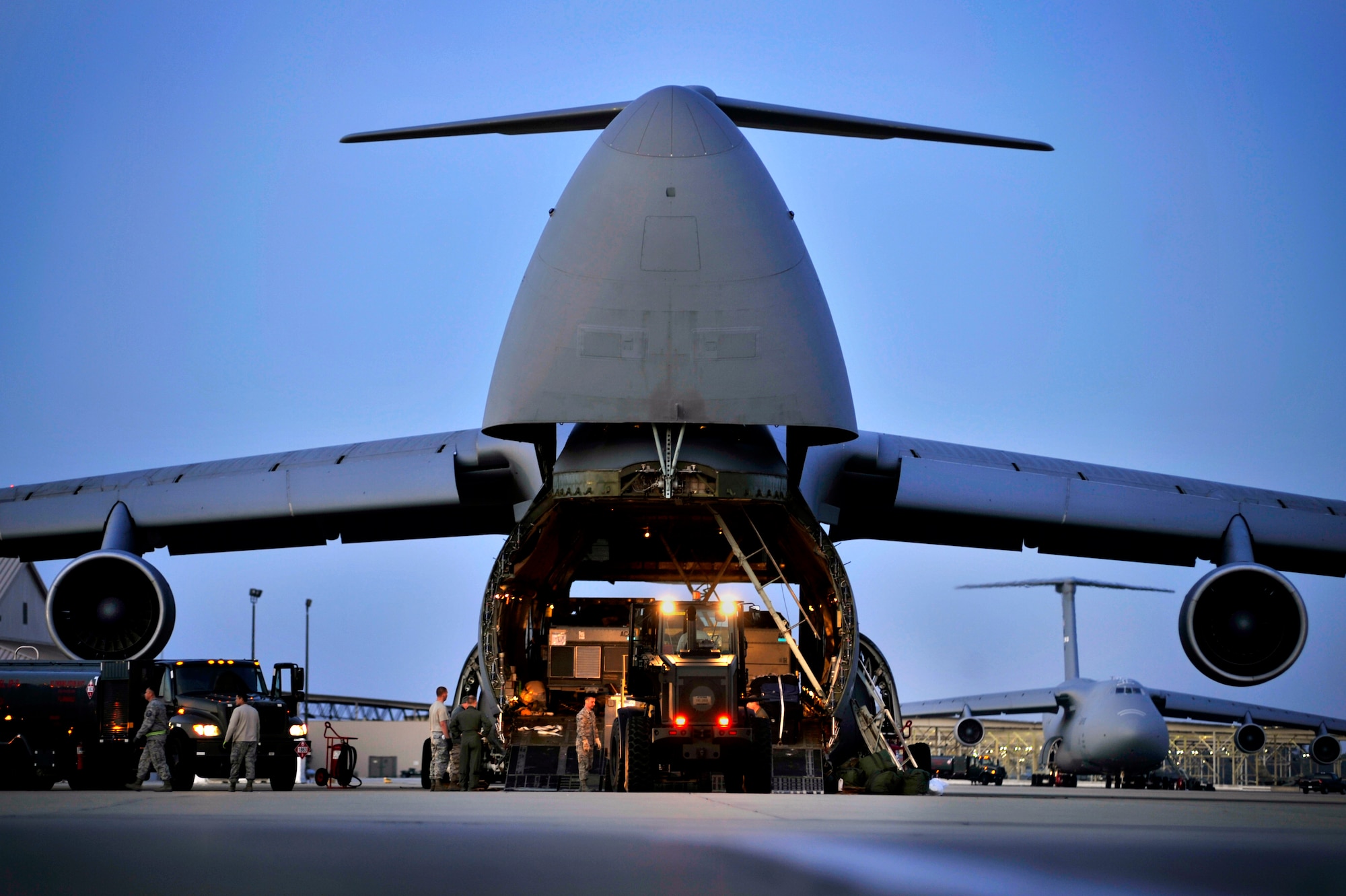 A U.S. Air Force C-5 Galaxy aircraft is loaded with aerospace ground equipment and other cargo on the flightline, Jan. 6, 2012, Shaw Air Force Base, S.C. Three C-5s landed at Shaw over a three day period to pick up Airmen and supplies in support of a deployment tasking being filled by Shaw Airmen. (U.S. Air Force Photo by Senior Airman Kenny Holston/Released)


