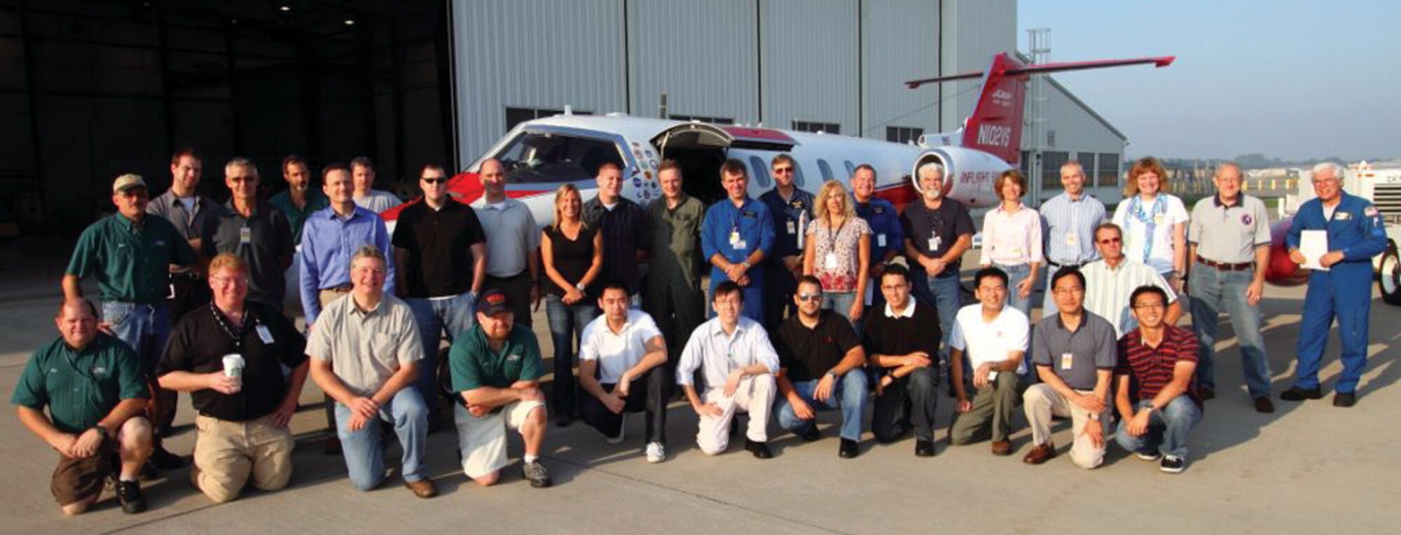 The Multiple Intruder Autonomous Avoidance (MIAA) team, which includes members from AFRL, Northrop Grumman, Calspan Flight Research, Birhle Applied Research, SelectTech Services, and FAA Hughes Tech Center, in front of Calspan’s Lear Jet In-Flight Simulator.  (Northrop Grumman Corporation Image)