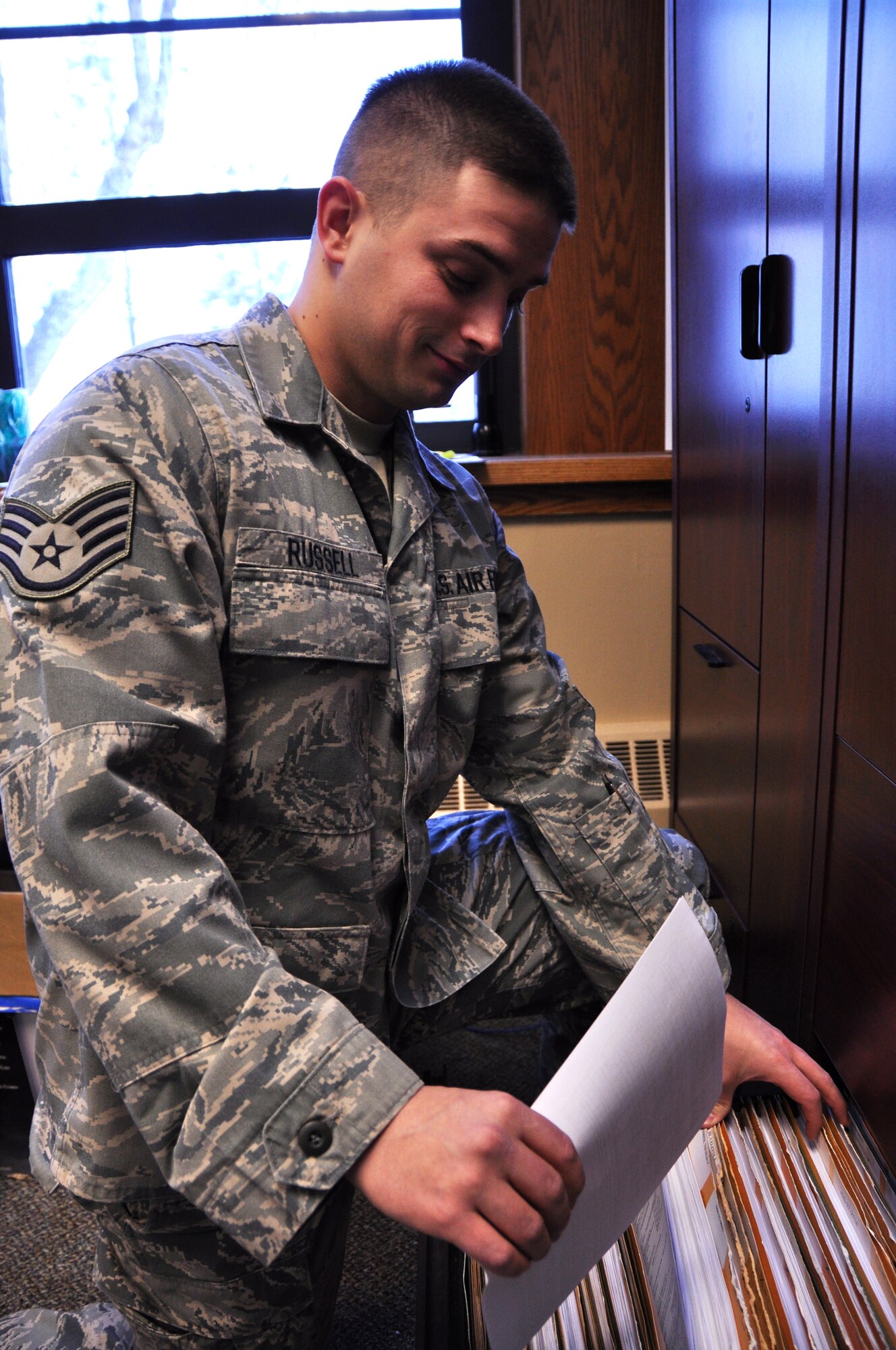 Staff Sgt. Alexander Russell, 466th Fighter Squadron, files paperwork at the squadron this UTA weekend. (U.S. Air Force photo/Airman 1st Class Crystal Charriere)