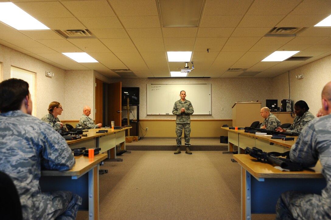 Senior Airman Nathan Warren, 28th Security Forces Squadron combat arms instructor, teaches a Combat Arms Training and Maintenance class for Airman on Ellsworth Air Force Base, S.D., Jan. 9, 2012. The class teaches Airmen how to properly handle weapons including disassembly, reassembly, safety, clearing, loading, reloading, and jams. (U.S. Air Force photo by Airman 1st Class Zachary Hada/Released)