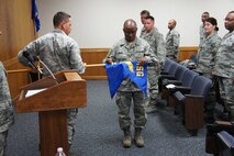 Members of the 916th Mission Support Group honor the 916th Communication Squadron as it deactivates during a ceremony on Sat. Jan. 7, 2012. (USAF photo courtesy of 916FSS)