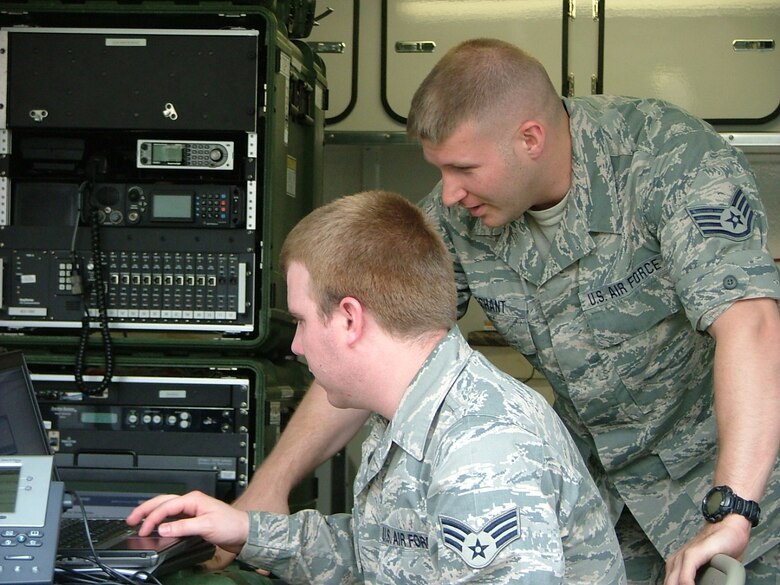 Staff Sgt. Matthew Dechant, cyber security specialist and Senior Airman Tyler Wardenski, transmission specialist, tag team the JISCC setup. Performing system updates is essential to ensure flawless satellite linking.  Team members of the 111th Communications Flight set up their mobile communication hub on Jun. 4, 2011 to run personnel through the steps of its set-up and operation, which is required
on a reoccurring basis. 

The Joint Incident Site Communication Capability (JISCC) kit offers a unique dimension of connection and information transfer. The demand for real time crisis management communications for federal, state and local authorities increases at the speed of technology.