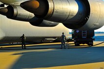 Members of the 20th Component Maintenance Squadron, refuel a C-5 Galaxy, Jan. 6, 2012. Three C-5s landed at Shaw Air Force Base S.C., over a three-day period to pick up Airmen and supplies in support of a deployment tasking. (U.S. Air Force Photo by Senior Airman Neil D. Warner/Released)