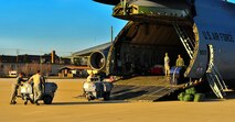 Members of the 20th Logistics Readiness Squadron load cargo onto a C-5 Galaxy, Jan. 6, 2012. Three C-5s landed at Shaw Air Force Base S.C., over a three-day period to pick up Airmen and supplies in support of a deployment tasking awaiting cargo loading filled by Airmen. (U.S. Air Force Photo by Senior Airman Neil D. Warner/Released)