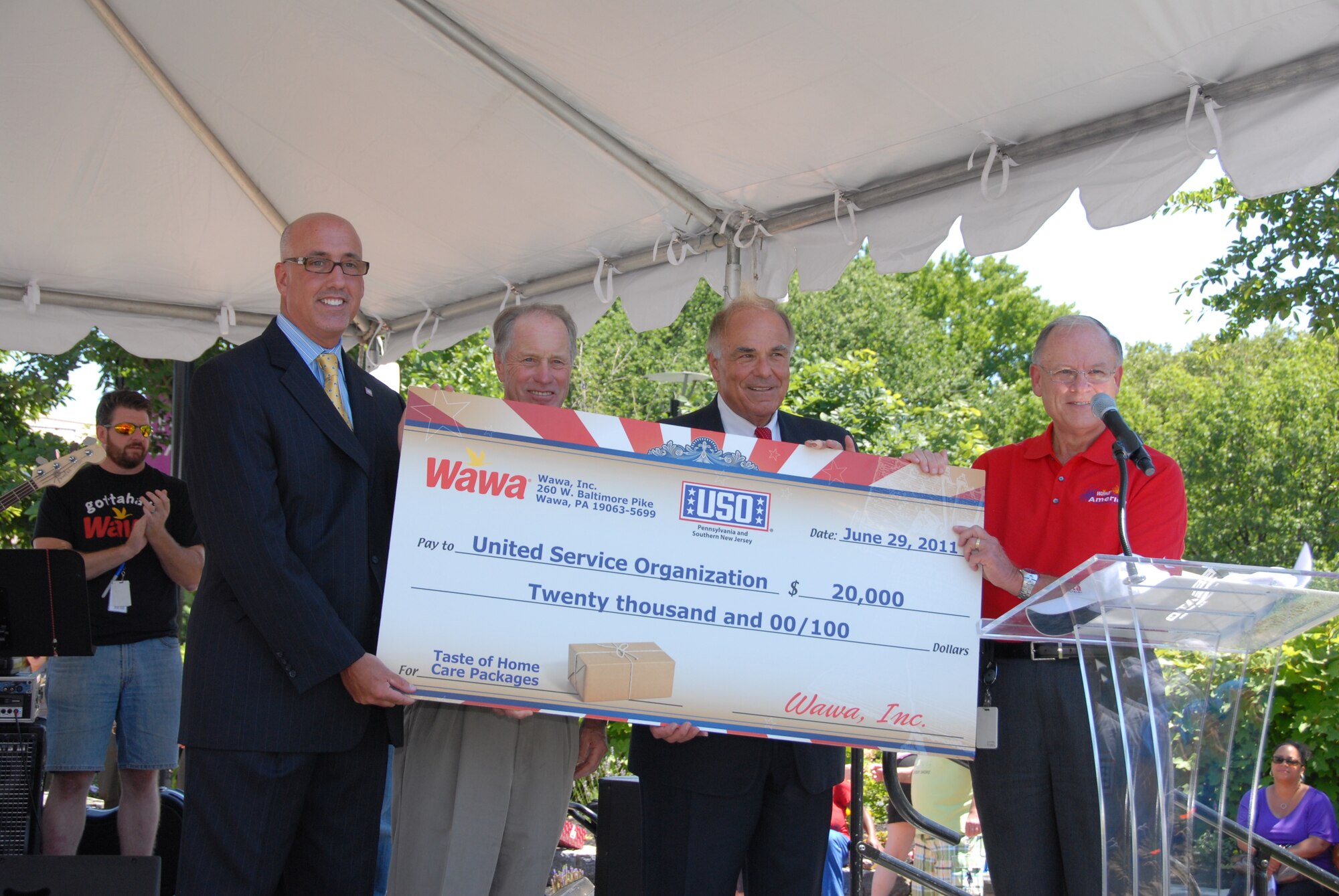 Wawa president and chief executive officer Howard Stoeckel and former Pennsylvania
Governor Edward Rendell present a check for $20,000 to United Services Organizations (USO) representative Joe Brooks at a ceremony held Jun. 29, 2011 during Wawa Welcome America Philadelphia Hoagie Day. The donation will provide 1,500 care packages that will be sent to troops overseas.