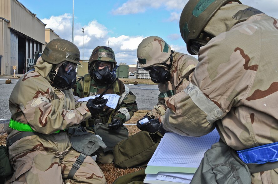 U.S. Air Force Tech. Sgt. Mindie Wright, 23rd Logistics Readiness Squadron traffic manager, left, directs members of the 23rd LRS during a simulated missile attack at Moody Air Force Base, Ga., Jan. 11, 2012. Moody members participated in a phase II operational readiness exercise that consisted of events that mimic situations faced in deployed locations. (U.S. Air Force photo by Airman 1st Class Olivia Dominique/Released)