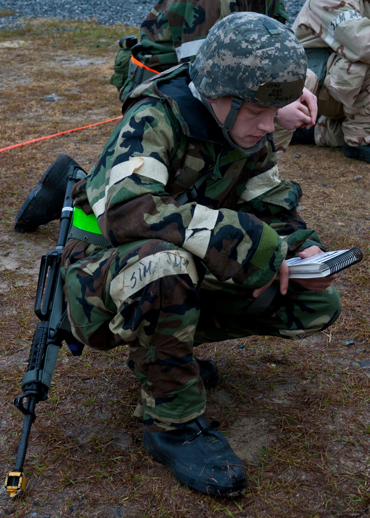 U.S. Air Force Airman 1st Class Lucas McCorkel, 23rd Civil Engineer Squadron, reads from his Airman’s Manual in a simulated bunker during a phase II operational readiness exercise at the field training exercise site Jan. 11, 2012, at Moody Air Force Base, Ga. There will be two more OREs before the operational readiness inspection this spring.. (U.S. Air Force photo by Senior Airman Eileen Meier/Released)